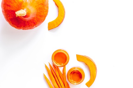 Baby food. Pumpkin puree on white background top viewの写真素材