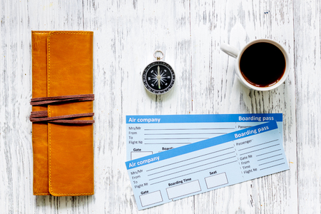 Buy tickets for travel. Tickets on light wooden table background top viewの写真素材