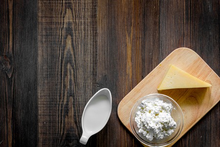 Non GMO, prservatives-free organic food on dark wooden background top view.