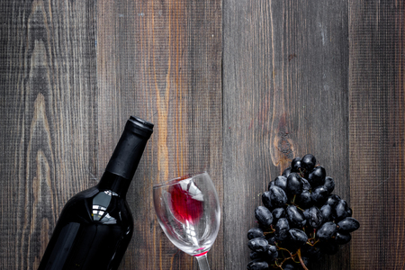 Wine glasses on dark wooden table background top view .の写真素材