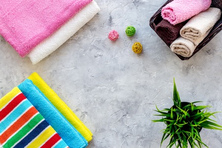 Clean towel on grey stone background top view.の写真素材