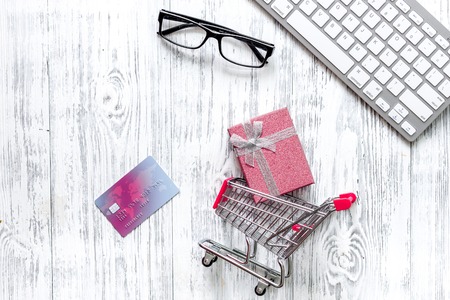 Shopping in webstore. Shopping cart, bank card and keyboardの写真素材