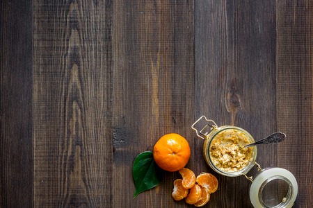 Sweet summer breakfast. Oatmeal, oranges, sugar on wooden table background top view.の写真素材