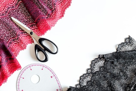 Clothing designer workplace. White background top view.