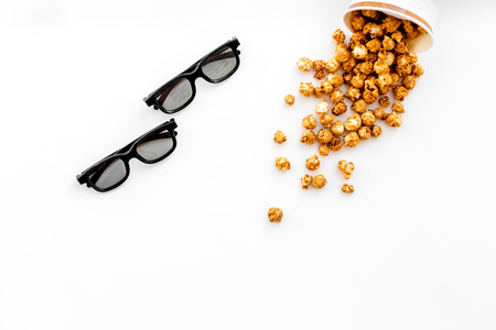 Snacks for film watching. Popcorn near glasses on yellow background top view copyspaceの写真素材