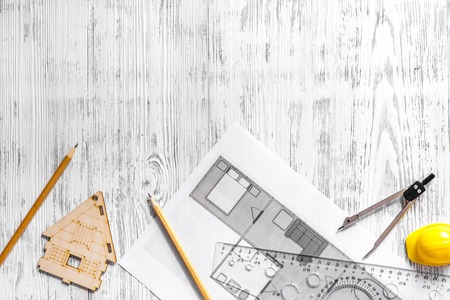 Architect at work. Drawing and tools on light wooden desk top view copyspaceの写真素材