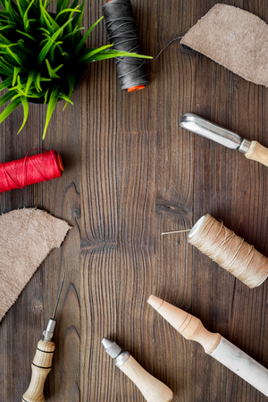 Tanner's tools on dark wooden table background top view.の写真素材
