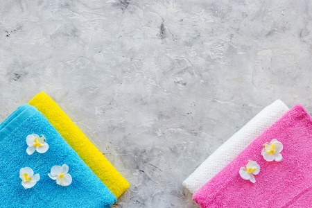 Linen after washing. Clean towel on grey stone background top view copyspaceの写真素材