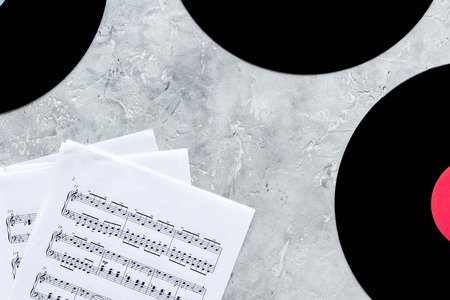 dj work set with notes and vynil records on stone table background top viewの写真素材