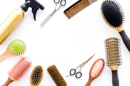 styling hair with combs and tools in barbershop on white background top view mock-upの写真素材