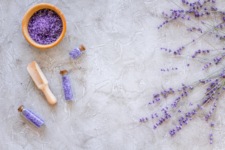home made spa with lavender herbs cosmetic salt for bath on stone desk background top view mock-upの写真素材