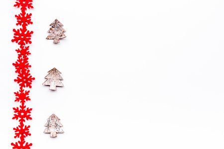 New Year decorations with toys fur tree and snowflakes on white background top veiw mock upの写真素材