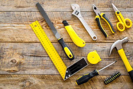 house renovation with implements set for building, painting and repair wooden table background top...