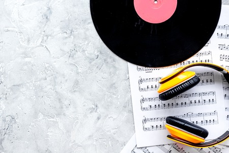 songwriter or dj work place with vynil and headphones on stone desk background top view mockupの写真素材