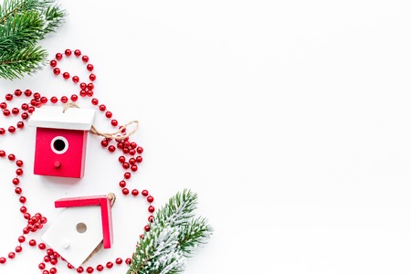 new year 2018 greeting with spruce branches and decorations with house toys on white table background top veiw space for textの写真素材