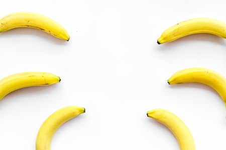 Tropical fruits background. Bananas pattern on white top view.の写真素材