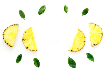 Tropical fruits background. Pinneapple on white top view.の写真素材