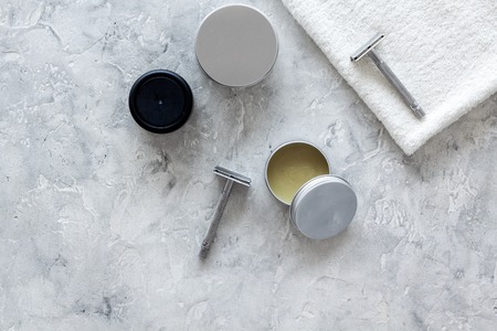 Mens shaving. Tools and cosmetics on grey stone background top view copyspaceの写真素材