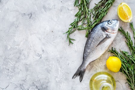 Fresh dorado fish ready to cook on grey background top view.の写真素材