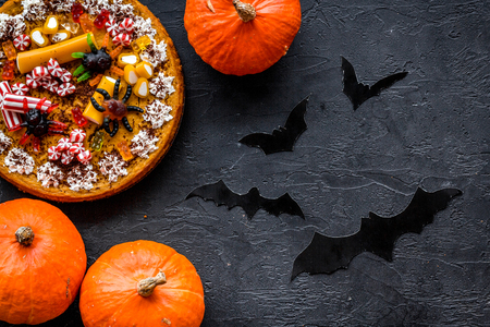 Halloween tradition. Pumpkin pie on black background top view.の写真素材