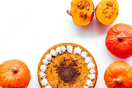 Pumpkin pie for thanksgiving day on white desk background top view.の写真素材