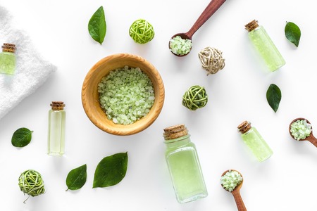green organic salt for bath with mint on white desk background top viewの写真素材