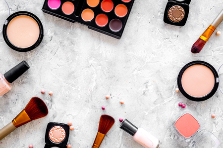 Eye shadows and rouges beige, nude colors on grey background top view.の写真素材