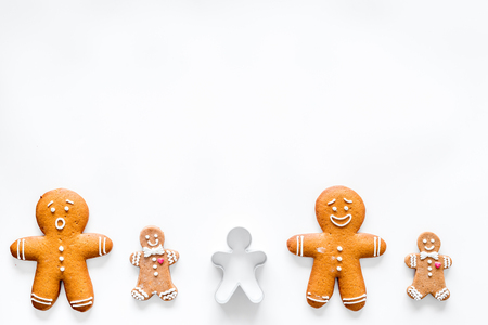 Gingerbread cookies of different shapes on white desk background top view space for textの写真素材