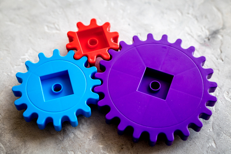 Moving forward concept with gears. Right decision and correct solution. stone desk backgroundの写真素材