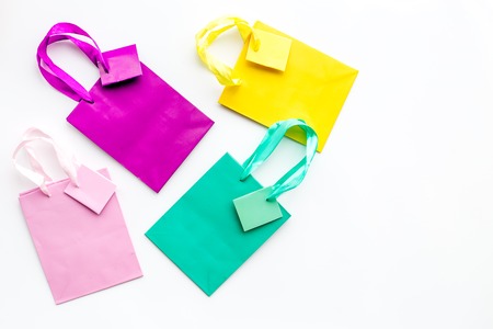 shopping bags for buying christmas and new year 2018 gifts on white desk background top view copyspaceの写真素材
