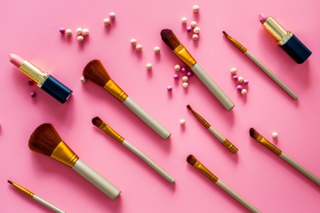 Natural makeup. Ball blushers and brushes pattern on pink background top viewの写真素材