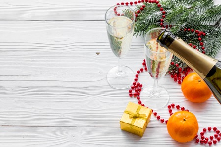 Glasses of champagne and new year decoration on grey wooden background copyspaceの写真素材