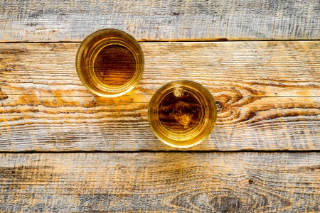 Whiskey cocktails on rustic wooden table background top view copyspaceの写真素材
