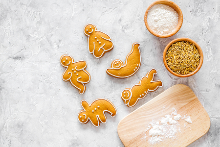 Make gluten free healthy food. Yoga asanas cookies near desk, flour and wheat on stone background top view mock upの写真素材