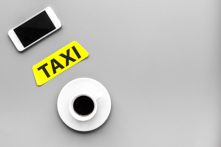 Choose a taxi in mobile application. Grey background top view.の写真素材