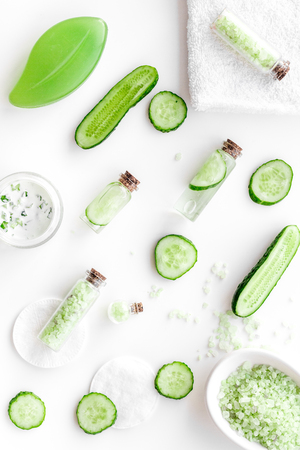 Fresh organic cosmetics with cucumber. Cream and lotion on white background top viewの写真素材