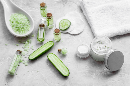 Natural cucumber cosmetics. Lotion, cream, spa salt on whiteの写真素材