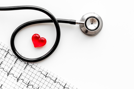 Examine the heart to prevent heart disease. Heart sign, cardiogram, stethoscope on white background top view copyspaceの写真素材