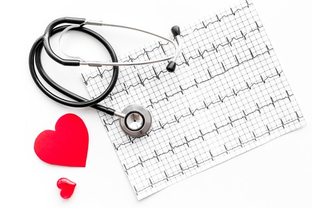Examine the heart to prevent heart disease. Heart sign, cardiogram, stethoscope on white background top viewの写真素材
