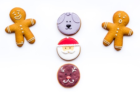 New Year Eves recipes. Gingerbread cookies with confictionery glaze on white background top view copyspaceの写真素材