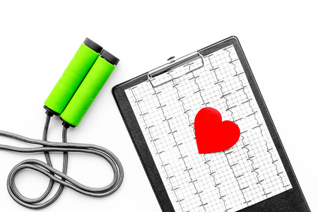 Prevent heart disease. Heart sign, cardiogram, jump rope on white background top viewの写真素材