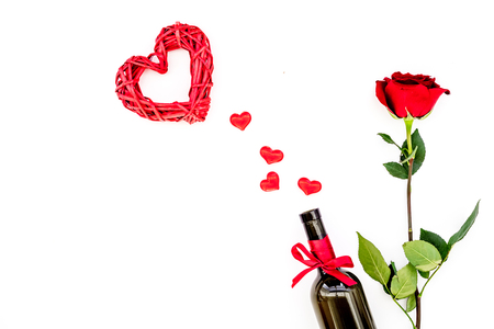 Wine and rose for Valentines day on white background top view copy spaceの写真素材