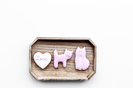Valentine cookies. Hearts with lettering I love you, cat and puppy on white background top view space for textの写真素材