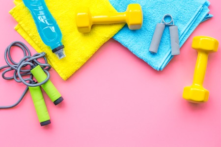Fitness equipment on pink background top view.の写真素材