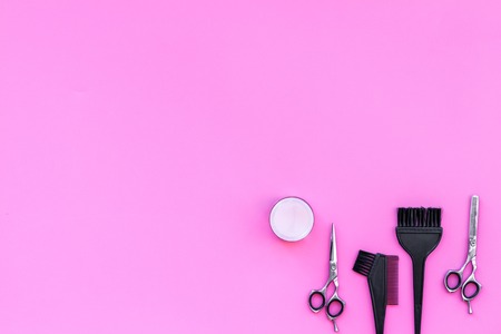 Professional hairdressing tools in beauty saloon on pink background top view.の写真素材