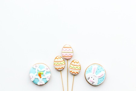 Sweets, pastry for Easter table. Easter eggs and Easter bunny concept. White background top view.の写真素材