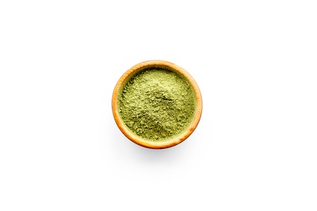 Powdered matcha green tea in bowl on white background top view copy spaceの写真素材