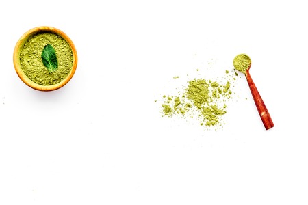 Powdered matcha green tea in bowl on white background top view copy spaceの写真素材