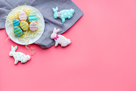 Easter gingerbread and cookies. Easter eggs and Easter bunny concept. Pink background top view.の写真素材