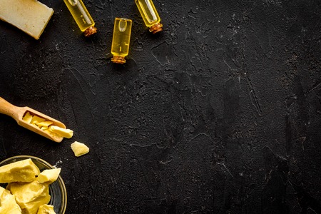 Homemade soap with cocoa butter. Cosmetics with natural ingredient. Black background top view.の写真素材